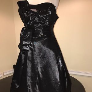 Black satin strapless cocktail dress.